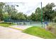 This is a professional tennis court surrounded by beautiful greenery with courtside seating at 8560 Queensway Blvd. # 1109, Myrtle Beach, SC 29572