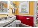 Bright bathroom with unique color scheme, modern fixtures, and a window for natural light at 908 Wood St., North Myrtle Beach, SC 29582