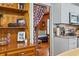 Open kitchen featuring stylish cabinets and shelving, with an open view into the sitting room at 908 Wood St., North Myrtle Beach, SC 29582