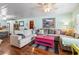 Cozy living room featuring hardwood floors, a ceiling fan and lots of natural light at 908 Wood St., North Myrtle Beach, SC 29582