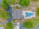 Aerial view of home with a pool, driveway and lush yard at 930 S Marlin Circle, Murrells Inlet, SC 29576