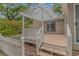 View of the deck with pergola from the stairs, showing access to the landscaped backyard at 930 S Marlin Circle, Murrells Inlet, SC 29576
