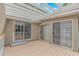 Wide view of back porch with multiple glass doors and white pergola covering the deck at 930 S Marlin Circle, Murrells Inlet, SC 29576
