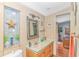 Bathroom with vanity, decorated walls, mirror, and access to main bedroom at 930 S Marlin Circle, Murrells Inlet, SC 29576