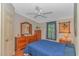 Bedroom with wood flooring, dresser, and blue bedding at 930 S Marlin Circle, Murrells Inlet, SC 29576