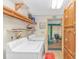 Laundry room with washer, dryer, storage shelves and natural light at 930 S Marlin Circle, Murrells Inlet, SC 29576