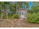 Well-maintained outbuilding with a classic design and stone pathway at 930 S Marlin Circle, Murrells Inlet, SC 29576