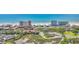 Breathtaking aerial view of oceanfront condos, a beautiful beach, and lush green marshland scenery at 9501 Shore Dr. # A-211, Myrtle Beach, SC 29572