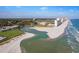 Breathtaking aerial view of a beautiful beach, golf course, and condo buildings, offering the perfect coastal lifestyle at 9501 Shore Dr. # A-211, Myrtle Beach, SC 29572