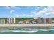 Spectacular aerial view featuring oceanfront condos and beautiful coastline, framed by blue water and sky at 9501 Shore Dr. # A-211, Myrtle Beach, SC 29572