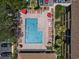 Stunning aerial view of a complex swimming pool with lounge chairs, umbrellas, and lush greenery, ideal for relaxation at 9501 Shore Dr. # A-211, Myrtle Beach, SC 29572