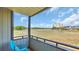 Inviting balcony with tranquil views of the marsh and distant buildings under a sunny, blue sky at 9501 Shore Dr. # A-211, Myrtle Beach, SC 29572