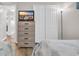 Tastefully decorated bedroom featuring a dresser with TV and an inviting view of a comfortable bed at 9501 Shore Dr. # A-211, Myrtle Beach, SC 29572