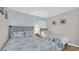 Cozy bedroom featuring two comfortable beds, complemented by soothing blue walls and charming decor at 9501 Shore Dr. # A-211, Myrtle Beach, SC 29572