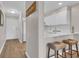 Kitchen with breakfast bar seating, and white cabinets with stainless appliances at 9501 Shore Dr. # A-211, Myrtle Beach, SC 29572
