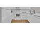 Bright white kitchen features stainless steel appliances and stylish countertops at 9501 Shore Dr. # A-211, Myrtle Beach, SC 29572
