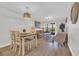 Open floor plan living room and dining area with sliding door access to deck at 9501 Shore Dr. # A-211, Myrtle Beach, SC 29572