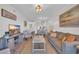 Open-concept living area showcases a comfortable living room, dining area, and a glimpse of the kitchen at 9501 Shore Dr. # A-211, Myrtle Beach, SC 29572