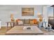 Comfortable living room features a plush sofa with beach-themed pillows, perfect for relaxing after a day at the beach at 9501 Shore Dr. # A-211, Myrtle Beach, SC 29572
