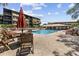 Relaxing pool area with comfortable lounge chairs and tables, perfect for enjoying sunny days in a serene environment at 9501 Shore Dr. # A-211, Myrtle Beach, SC 29572