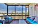 Relaxing screened-in porch with comfortable seating and serene views of the surrounding marsh at 9501 Shore Dr. # A-211, Myrtle Beach, SC 29572