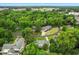 A high aerial view showcases homes nestled among lush trees in a quiet neighborhood at 966 Waterway Ln., Myrtle Beach, SC 29572
