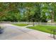 Well-maintained backyard with a white picket fence and mature trees at 966 Waterway Ln., Myrtle Beach, SC 29572
