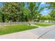 Green backyard featuring a white picket fence and mature trees at 966 Waterway Ln., Myrtle Beach, SC 29572