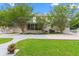 Home's backyard featuring mature trees, well-kept grass, and a white fence at 966 Waterway Ln., Myrtle Beach, SC 29572