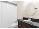 Cozy bathroom featuring a dark vanity and mirror; perfect for a quick refresh at 966 Waterway Ln., Myrtle Beach, SC 29572