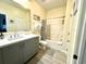 Bright bathroom with a modern vanity, updated fixtures, and a shower-tub combination at 9780 Leyland Dr. # 112, Myrtle Beach, SC 29572