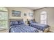 Nautical bedroom featuring two beds, coordinated bedding, decor and natural light from windows at 9780 Leyland Dr. # 112, Myrtle Beach, SC 29572