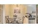 Charming dining area with a decorative chandelier and stylish kitchen adjacent at 9780 Leyland Dr. # 112, Myrtle Beach, SC 29572