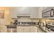 Well-equipped kitchen featuring stainless steel appliances, granite countertops and ample cabinet space at 9780 Leyland Dr. # 112, Myrtle Beach, SC 29572