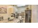 Open-concept kitchen and dining area, with modern appliances and plenty of cabinet space at 9780 Leyland Dr. # 112, Myrtle Beach, SC 29572