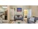 Comfortable living room featuring a cozy sofa, and an adjacent kitchen and bathroom at 9780 Leyland Dr. # 112, Myrtle Beach, SC 29572