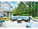 Inviting backyard patio area with an outdoor sectional and lush landscaping at 990 Palisade Circle, Myrtle Beach, SC 29577