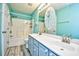 Bathroom featuring double sinks, a spacious vanity, and a tub with a shower at 990 Palisade Circle, Myrtle Beach, SC 29577
