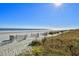 Beautiful sandy beach with distant ocean views under a bright, sunny sky at 990 Palisade Circle, Myrtle Beach, SC 29577