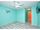 Clean bedroom featuring a fan, wall-mounted TV, and closet at 990 Palisade Circle, Myrtle Beach, SC 29577