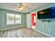 Bedroom with light blue walls, a ceiling fan, and wood-look flooring at 990 Palisade Circle, Myrtle Beach, SC 29577