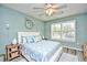 Bright bedroom featuring stylish decor, a ceiling fan, and natural light from the window at 990 Palisade Circle, Myrtle Beach, SC 29577