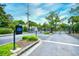 Gated community entrance with security access point, mature trees, and meticulous landscaping at 990 Palisade Circle, Myrtle Beach, SC 29577