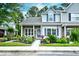 Charming home featuring a beautifully landscaped yard with vibrant flowers and manicured shrubs at 990 Palisade Circle, Myrtle Beach, SC 29577