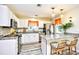 Well-appointed kitchen featuring white cabinets, granite countertops, and stainless steel appliances at 990 Palisade Circle, Myrtle Beach, SC 29577