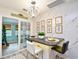 Kitchen dining area with modern lighting, black countertop, and sliding glass doors at 990 Palisade Circle, Myrtle Beach, SC 29577