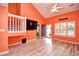 Spacious living room with high ceilings, wood-look flooring, and natural light through large windows at 990 Palisade Circle, Myrtle Beach, SC 29577