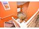 View of wood-look stairway from above with decor on the landing and a painting above at 990 Palisade Circle, Myrtle Beach, SC 29577
