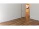 Bedroom boasting hardwood floors and an open doorway, creating an inviting atmosphere at Tbd Aft Ct # 101, Murrells Inlet, SC 29576