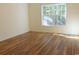 This bedroom features hardwood floors and a large window, providing ample natural light at Tbd Aft Ct # 101, Murrells Inlet, SC 29576